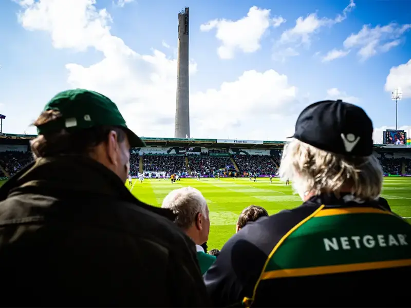 Two lifelong Northampton Saints supporters watching together from the stands